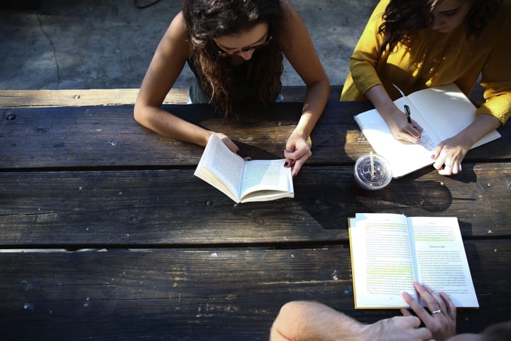 three-women-meeting-around-table