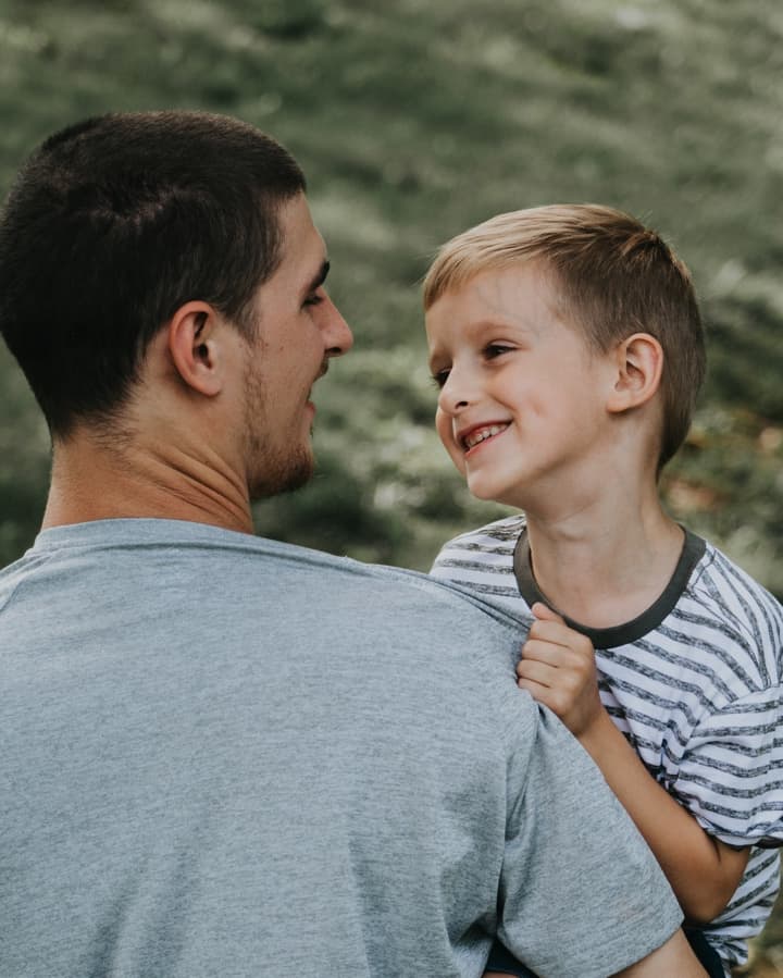 Dad looking his son in the eyes