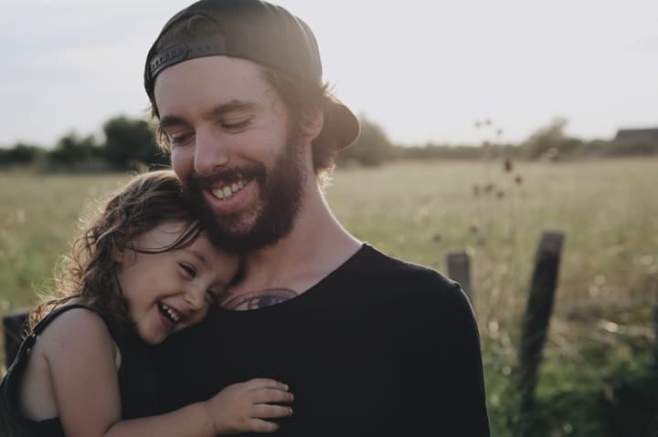 Dad with his daughter on his chest