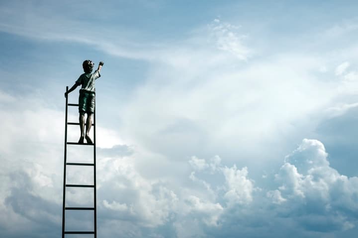 Child reaching for the sky